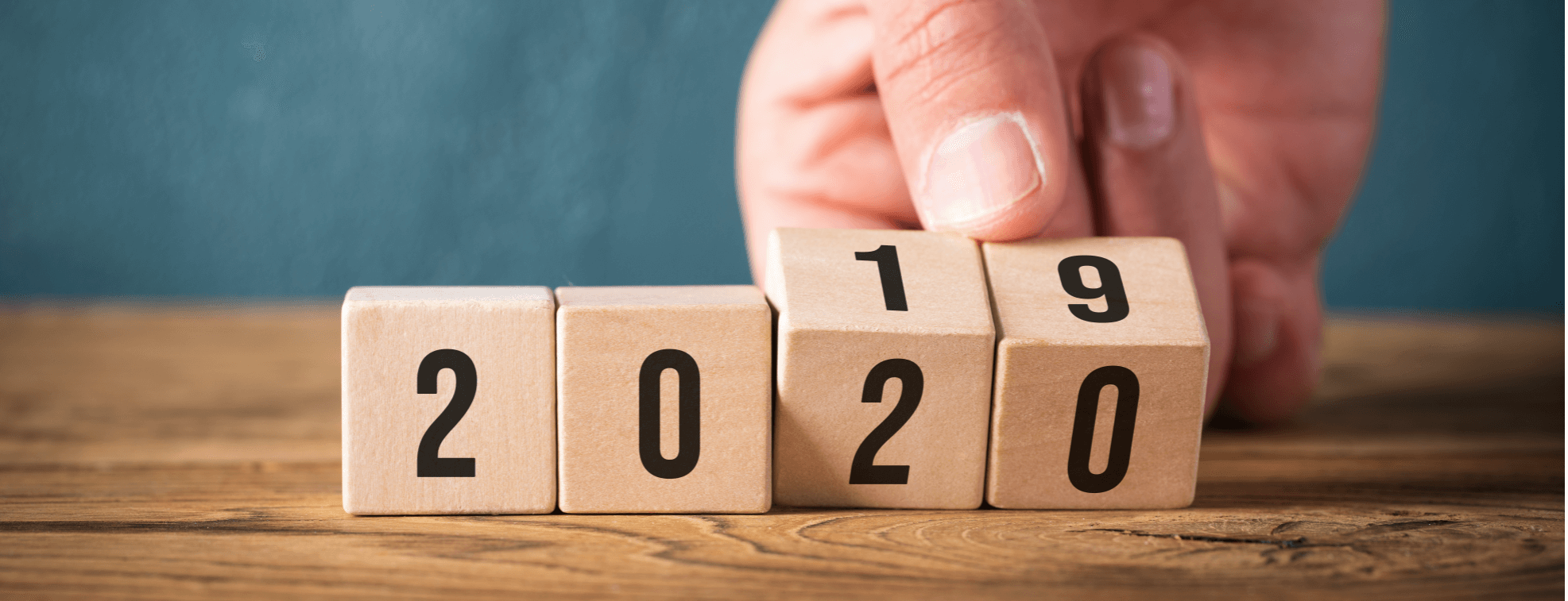 Person turning cubes with number from 2019 into 2020