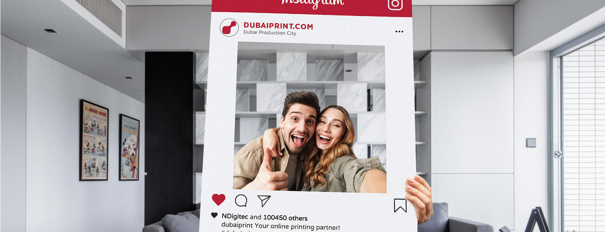 Couple looking cheerfully through a custom made instagram frame